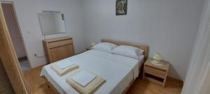 Posteľ alebo postele v izbe v ubytovaní Apartment Anchi