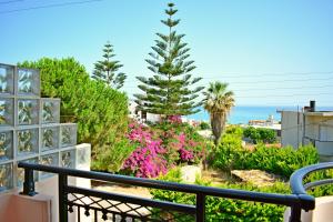 a view of a garden from a balcony at Melina's House in Stalos
