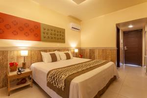 Krevet ili kreveti u jedinici u objektu Ocaporã Hotel All Inclusive