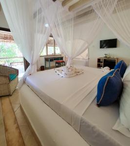 Säng eller sängar i ett rum på Temple Point Resort