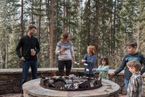 a group of people standing around a fire pit at Bear Creek Lodge in Telluride
