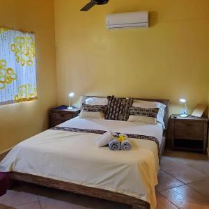 a bedroom with two beds with towels on the bed at Casa Barbara in Las Terrenas +53 photos