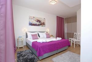 Postel nebo postele na pokoji v ubytování Villa Žnjan