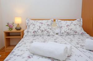 Postel nebo postele na pokoji v ubytování Villa Žnjan