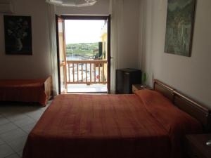 Tempat tidur dalam kamar di Al Martin Pescatore