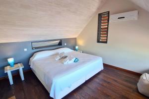 Postel nebo postele na pokoji v ubytování Villa Moana