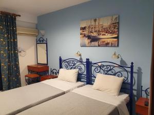 Postel nebo postele na pokoji v ubytování Hotel Mike
