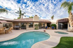 a house with a swimming pool and a patio at Everything You Want! Golf Course, Views, Pool/Spa in Palm Desert