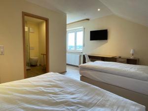 Een bed of bedden in een kamer bij Hotel Andrea