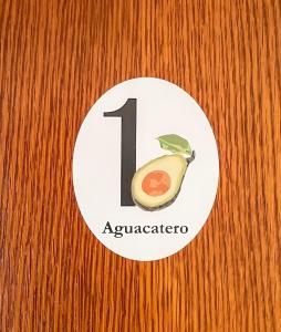 a wooden door with a number sign on it at Canary Bio Hostel Tenerife in Los Realejos