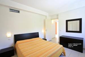 Postel nebo postele na pokoji v ubytování Sporting Club Resort + 68 fotografií