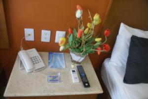 Postel nebo postele na pokoji v ubytování Hotel Arcos Aeropuerto