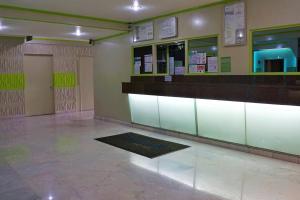 a lobby with a waiting room with signs on the wall at Hotel Duque in Mexico City