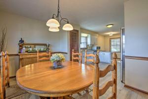 a kitchen and dining room with a wooden table at Lexington Home about 2 Mi to University of Kentucky! in Lexington