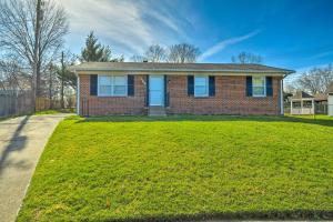 a brick house with blue doors on a lawn at Lexington Home about 2 Mi to University of Kentucky! in Lexington