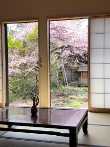 a vase sitting on a table in front of a window at Kitaguchi Tougakukan in Fujiyoshida +17 photos