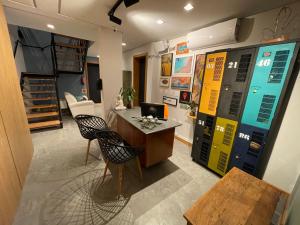 an office with a desk and chairs in a room at Hospedaria da Lagoa in Florianópolis