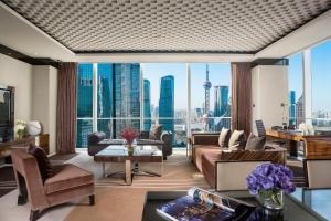 a living room with a view of a city at Regent Shanghai Pudong - Complimentary first round minibar per stay - including a bottle of wine in Shanghai
