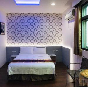 En eller flere senge i et værelse på Purple Shell Homestay