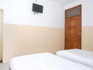 Ein Bett oder Betten in einem Zimmer der Unterkunft Rajasa Hotel