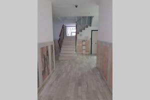 an empty hallway with stairs in a building at Apartamento con piscina en el centro de Blanes in Blanes