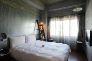 Llit o llits en una habitació de Hualien Wow Hostel