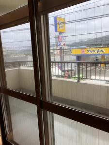 a view from a window of a shopping mall at Amami Weekly House Nico Nico Nazeko-ten in Amami