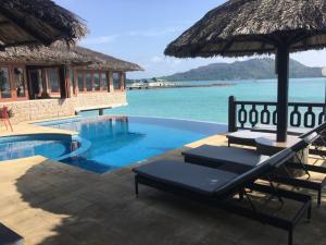 Bazén v ubytování Cote Jardin - Chalets Cote Mer nebo v jeho okolí + 10 fotografií