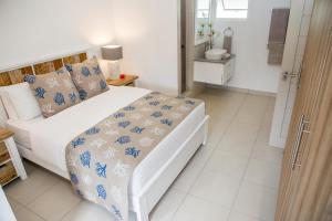 Letto o letti in una camera di Villas Coco Beach Praslin