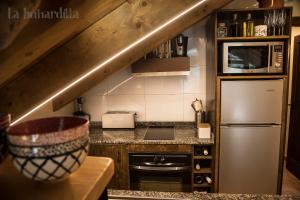 Kuchyňa alebo kuchynka v ubytovaní Abadía de Montenartró Apartamentos