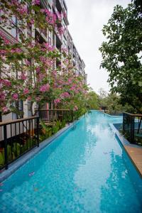 a swimming pool in the middle of a building at La Habana in Hua Hin +8 photos