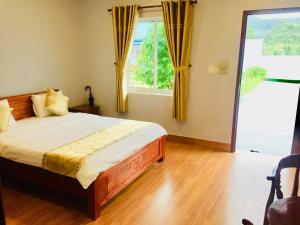 Postel nebo postele na pokoji v ubytování BUNGALOW HOTEL