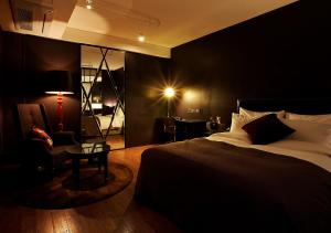 Postelja oz. postelje v sobi nastanitve Lee Design Hotel