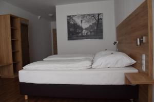 Ένα ή περισσότερα κρεβάτια σε δωμάτιο στο Hotel Sammeth Bräu