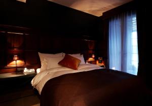 Postelja oz. postelje v sobi nastanitve Lee Design Hotel