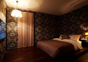 Postelja oz. postelje v sobi nastanitve Lee Design Hotel