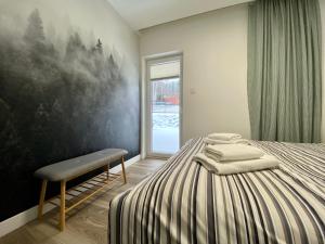 Ένα ή περισσότερα κρεβάτια σε δωμάτιο στο Apartament MK - Na Szczyt