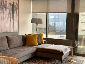 a living room with a couch and a large window at Umhlanga Arch Gem in Durban
