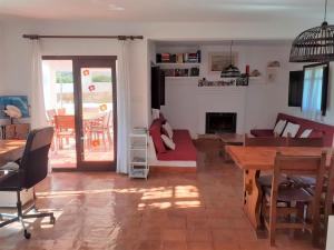 a living room with a couch and a table at CASA PIZZI in Agua Amarga