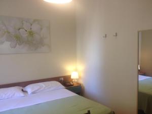 Postel nebo postele na pokoji v ubytování Hotel Terme Belvedere