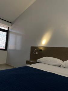 Posteľ alebo postele v izbe v ubytovaní Hotel Cristian