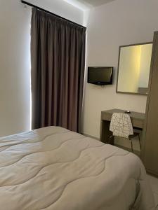 Posteľ alebo postele v izbe v ubytovaní Hotel Cristian