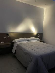 Posteľ alebo postele v izbe v ubytovaní Hotel Cristian