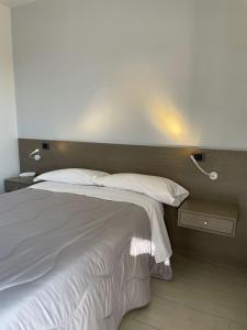 Posteľ alebo postele v izbe v ubytovaní Hotel Cristian