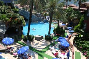 an overhead view of a pool with people in a resort at Grand Aquarium in Marmaris