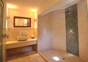 a bathroom with a shower and a sink at Villa Aquilo in Megali Ammos