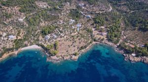 an aerial view of a island with blue water at Villa Aquilo in Megali Ammos