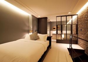 Postelja oz. postelje v sobi nastanitve Lee Design Hotel
