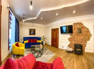 a living room with a couch and a fireplace at Апартаменти Стара Ворохта in Vorokhta