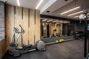 a gym with several treadmills and cardio machines at Premium Club SPA in Bukovel